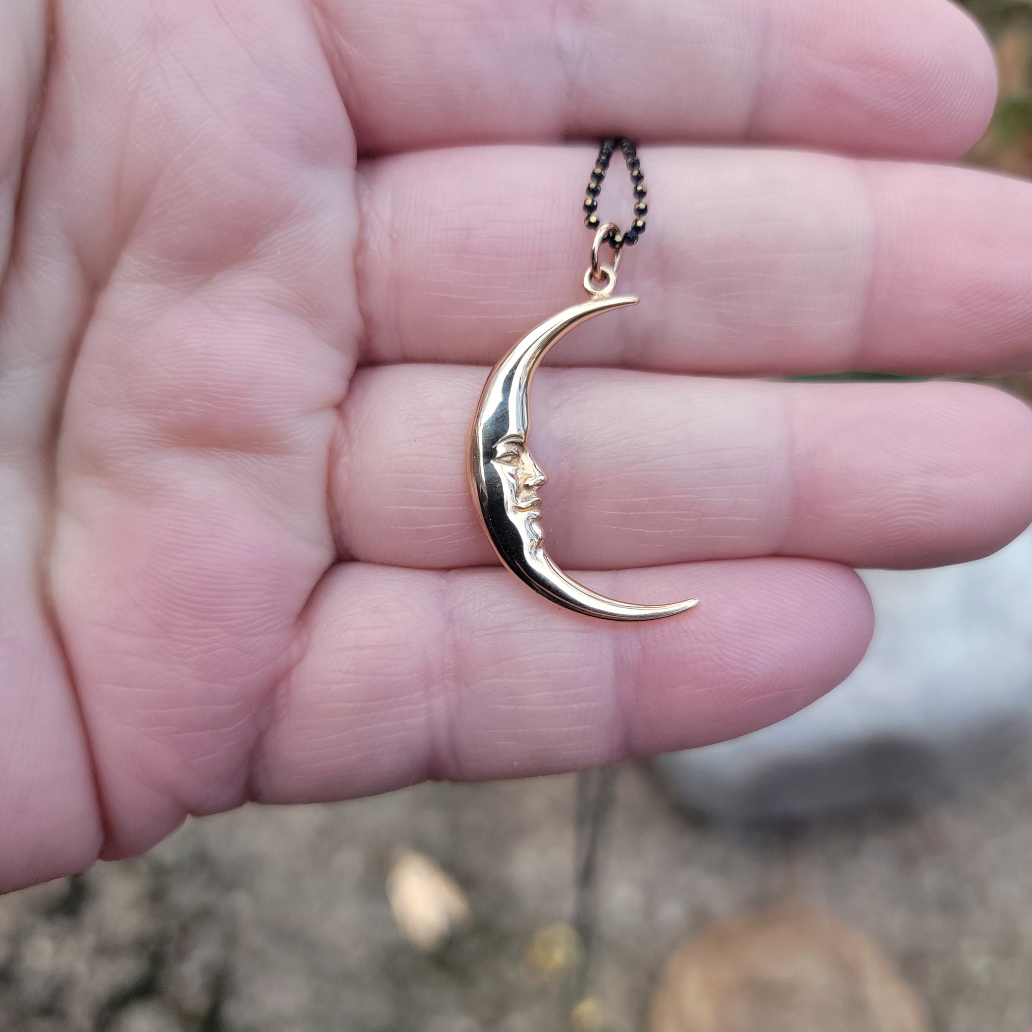 Man on the Moon Bronze Crescent Pendant