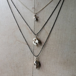 Mini Bronze Skull Pendant