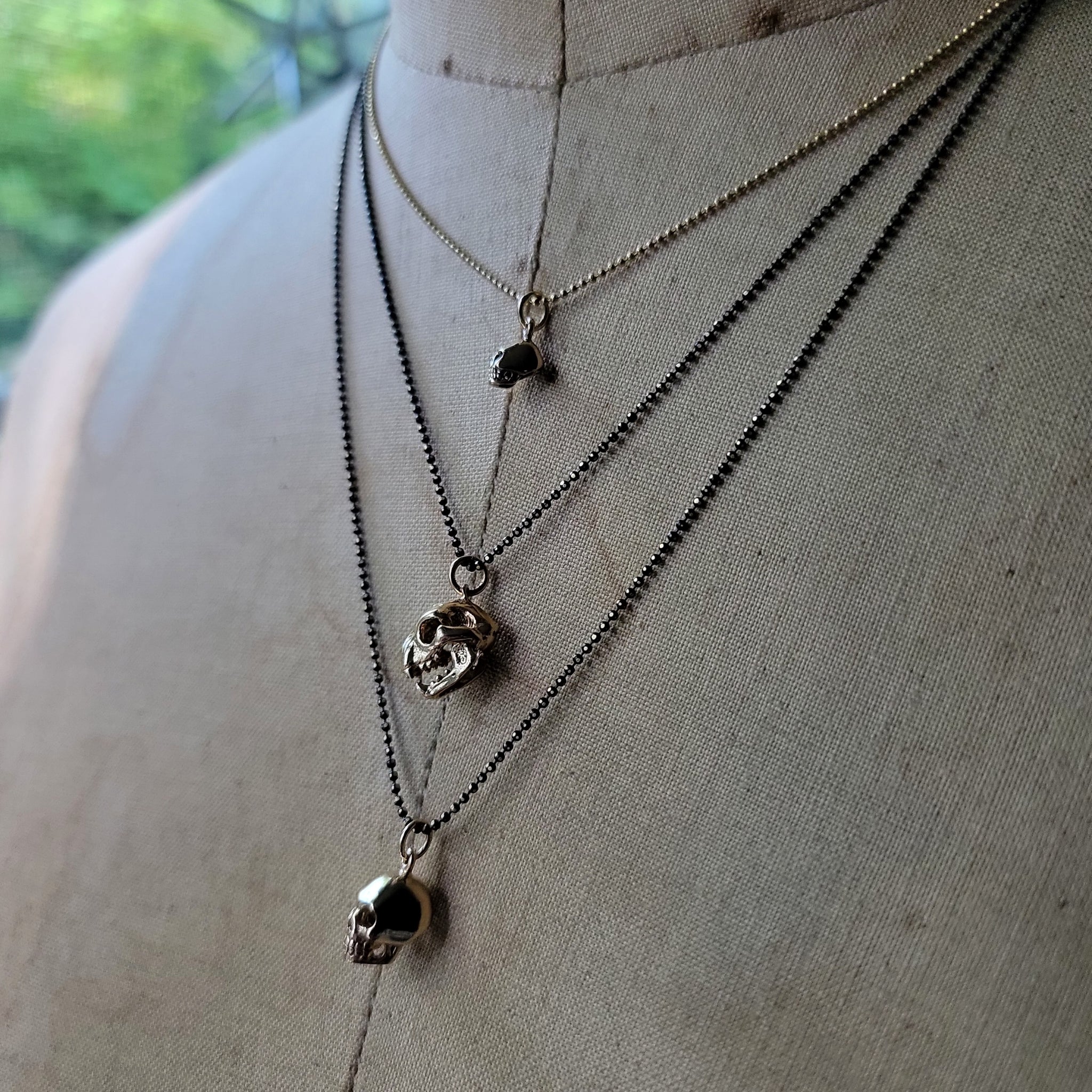 Mini Bronze Skull Pendant
